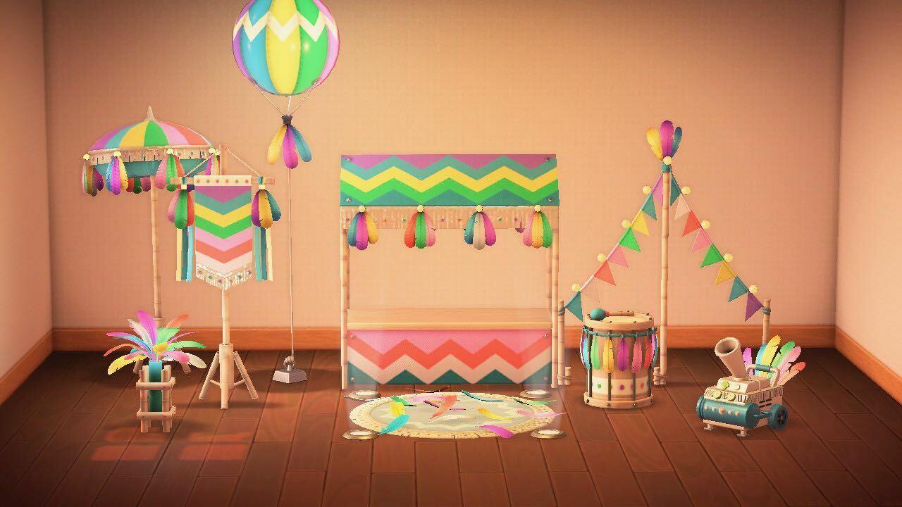 The Festivale set in the rainbow color variant. From left to right, back to front: parasol, lamp, flag, balloon lamp, stall, stage, garland, drum, and confetti machine. You can see the other color variants in the gallery below.