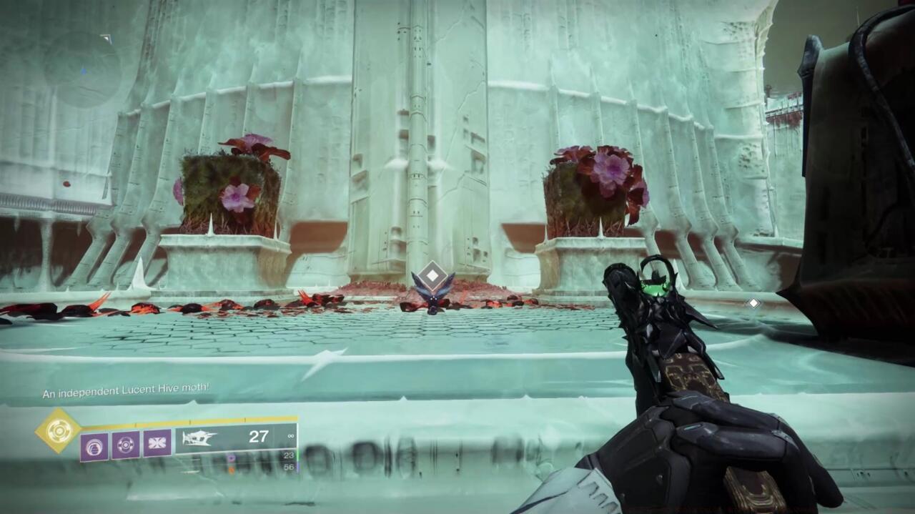 The moth will appear on top of this building, at the top of the stairs.