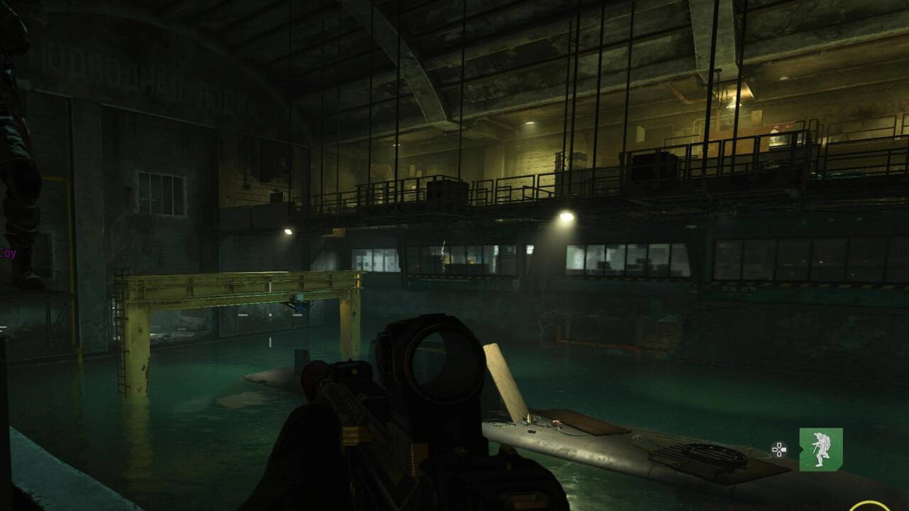 Yellow crane above submarine