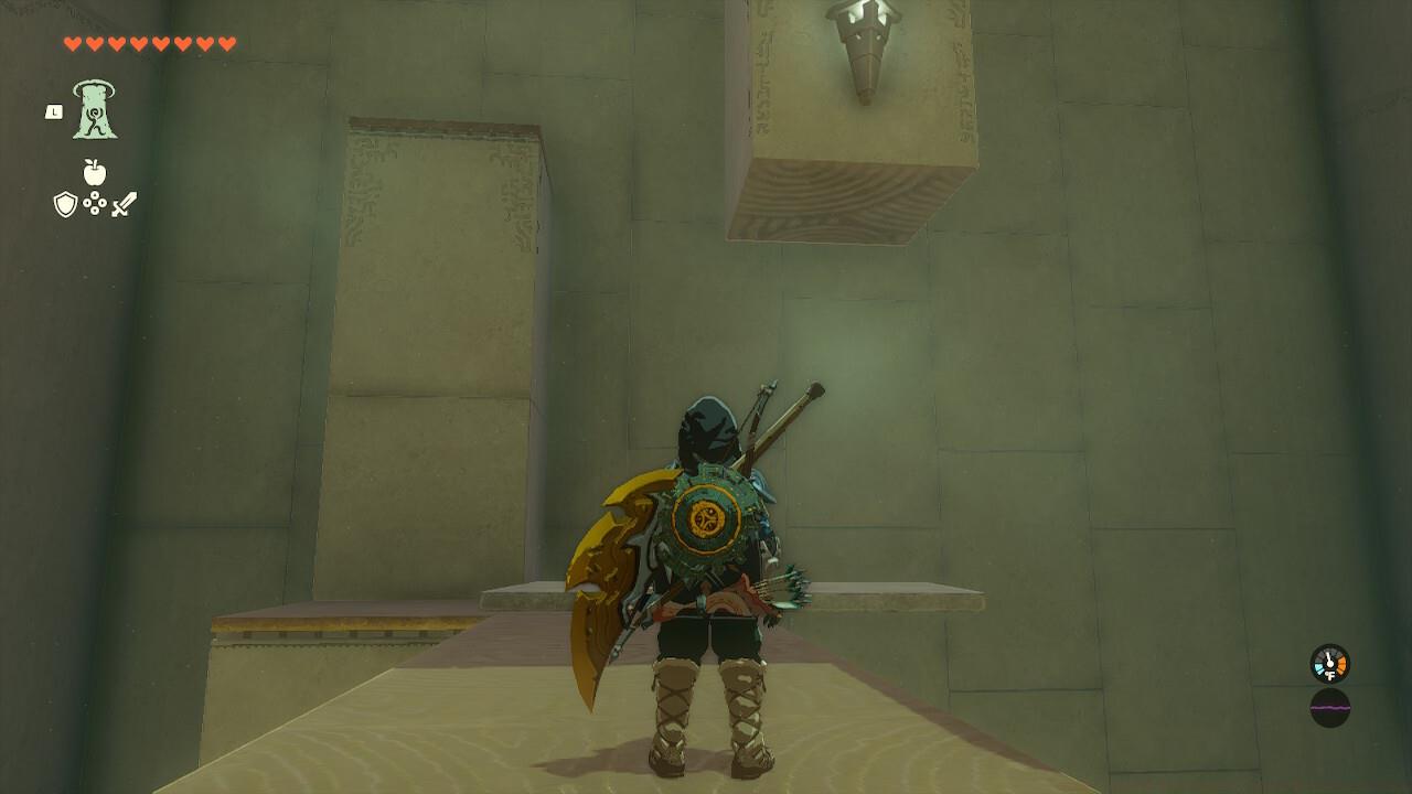 Balance the block off the ledge so you can get underneath the pillar.