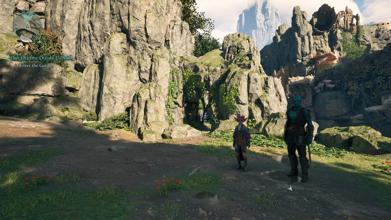 Head through the small opening in the rocks shown above.