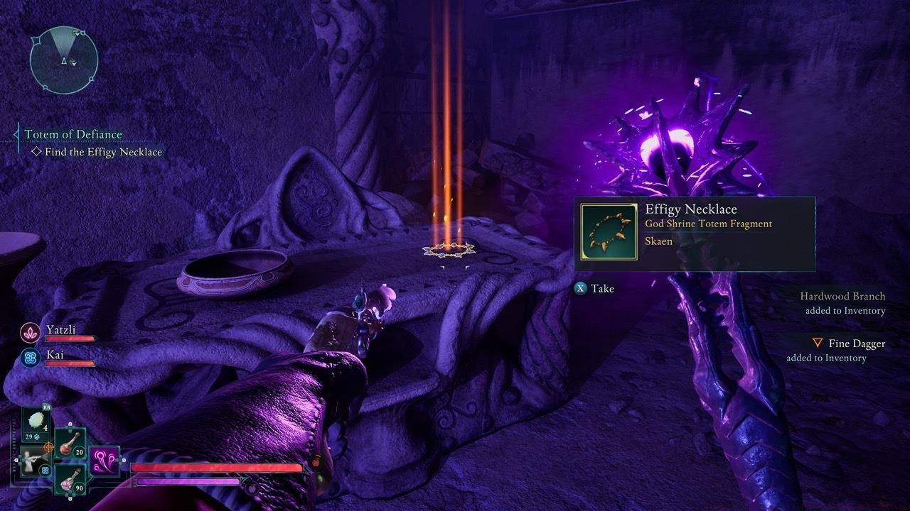 The Effigy Necklace can be found on this table on the ledge.