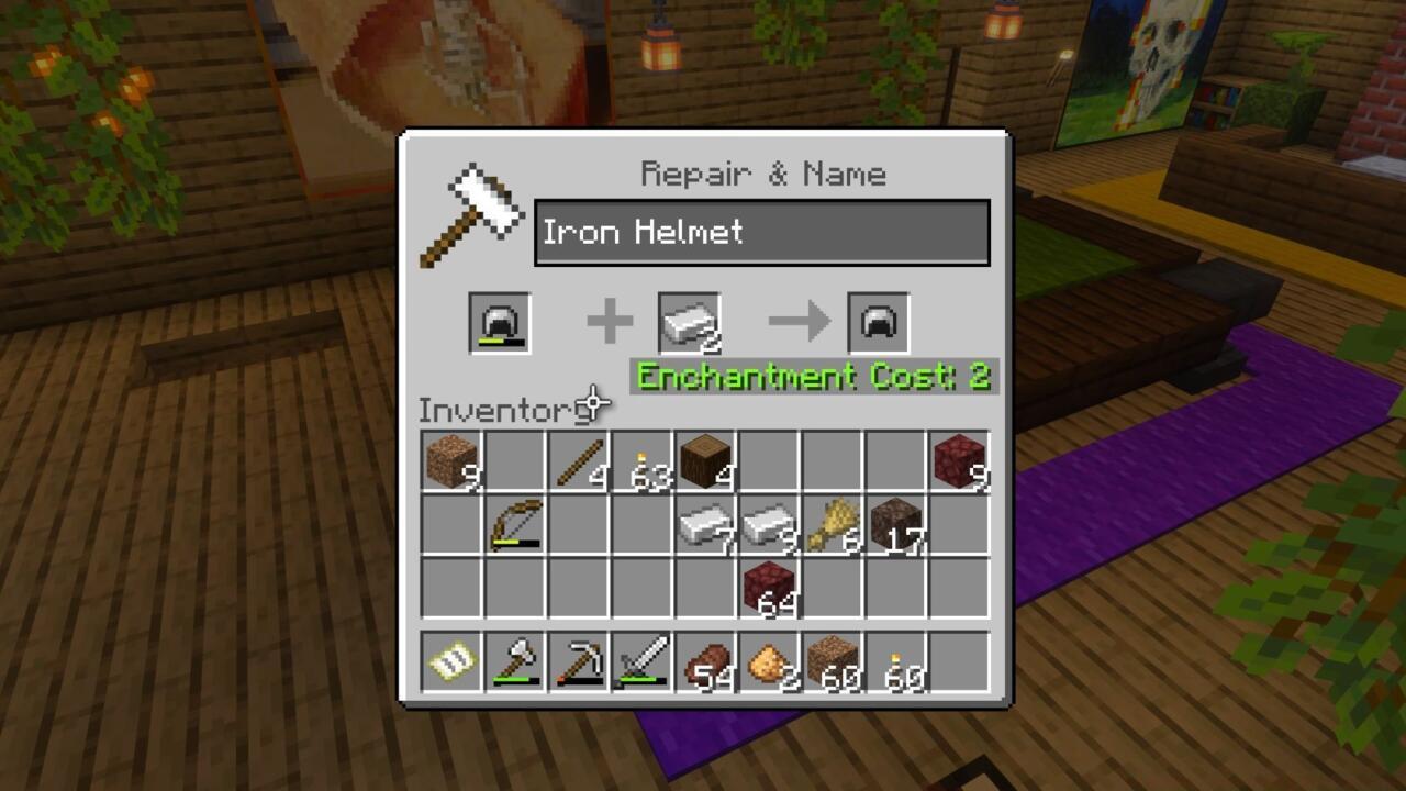 Repairing an iron helmet at an anvil