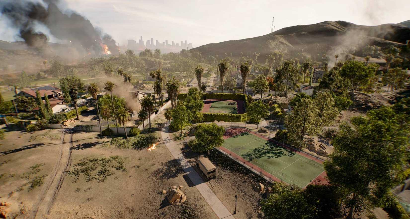 The Eastwood map in Battlefield 6, featuring smoke billowing on the horizon, tennis courts in the foreground, and smoke plumes.