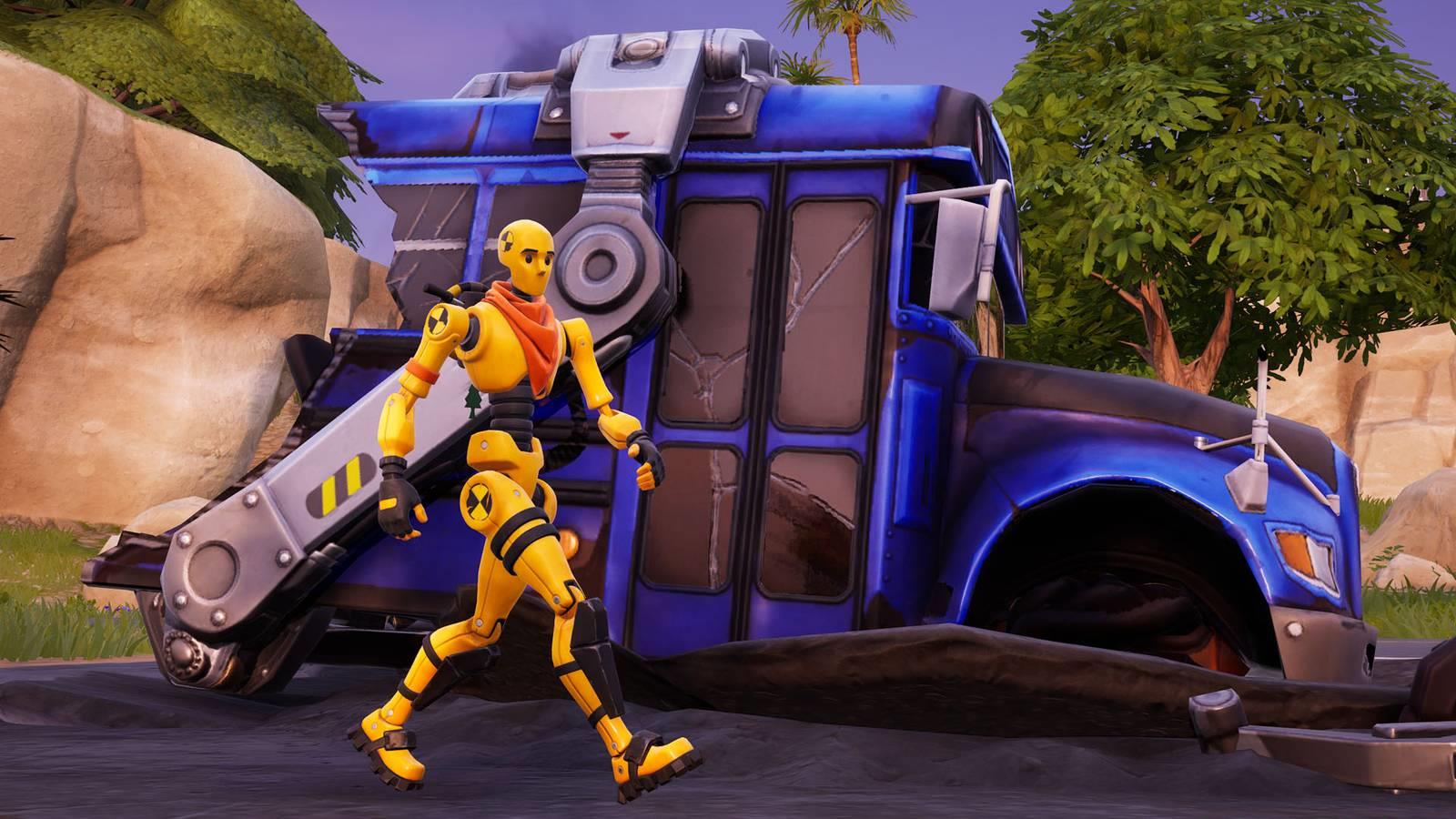 Dummy walking in front of the destroyed battle bus in Fortnite.